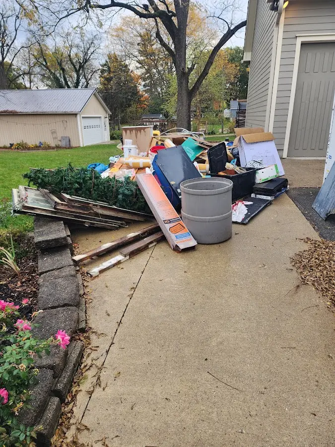 Dumpster being loaded with debris for Roofing Dumpster Rental in Yonkers
